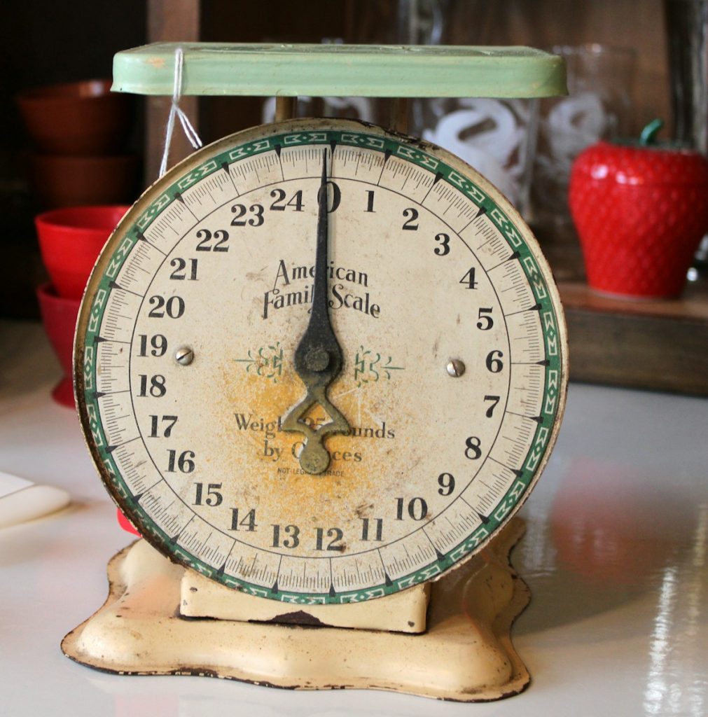 an old time clock sitting on a table