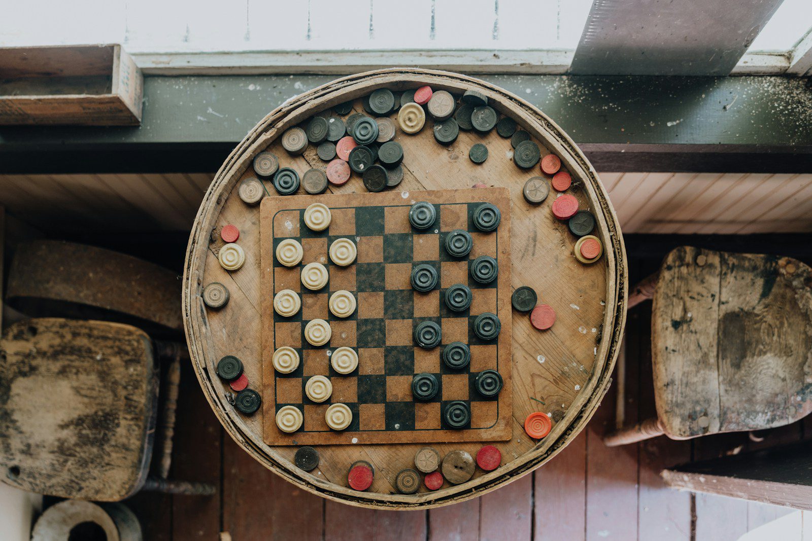 A wooden board game set up on a wall