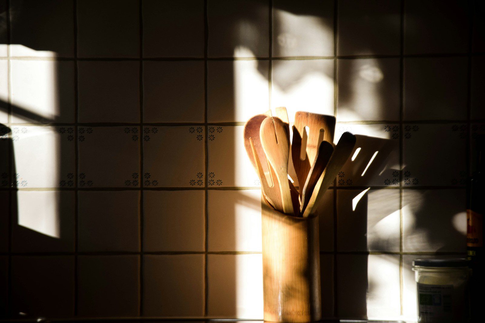 brown wooden handled fork and knife on brown wooden chopping board