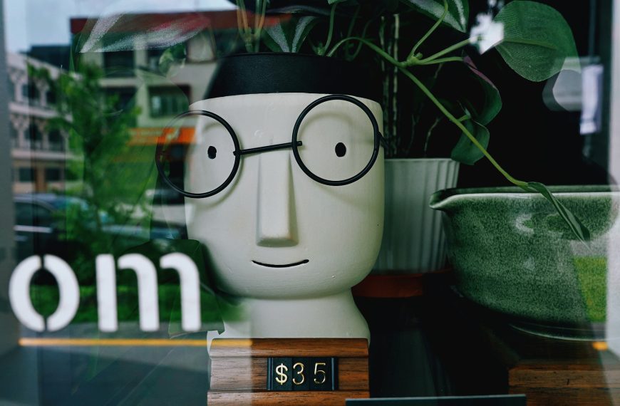 Head-shaped planter with glasses and plants
