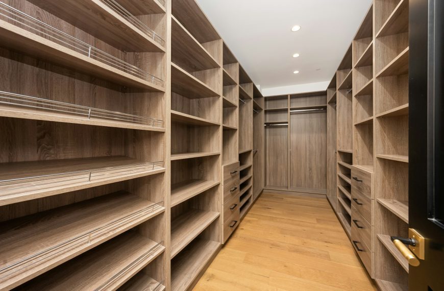 A room filled with lots of wooden shelves