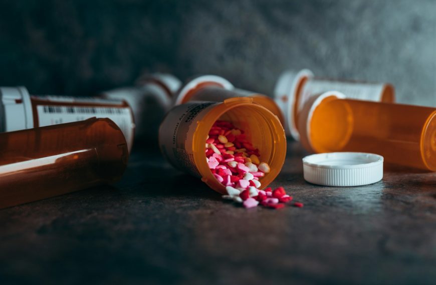 a close up of a bottle of pills on a table
