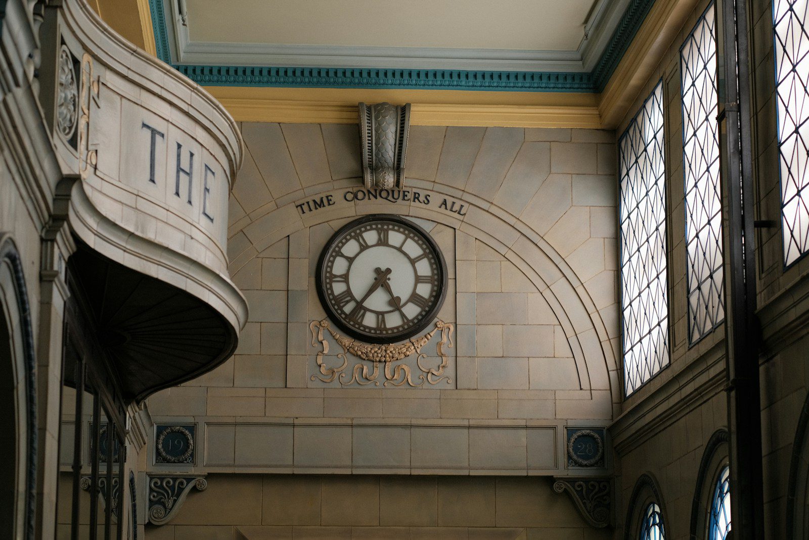 A large clock mounted to the side of a wall
