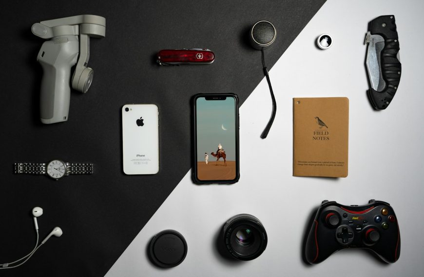 a collection of electronics and gadgets laid out on a table