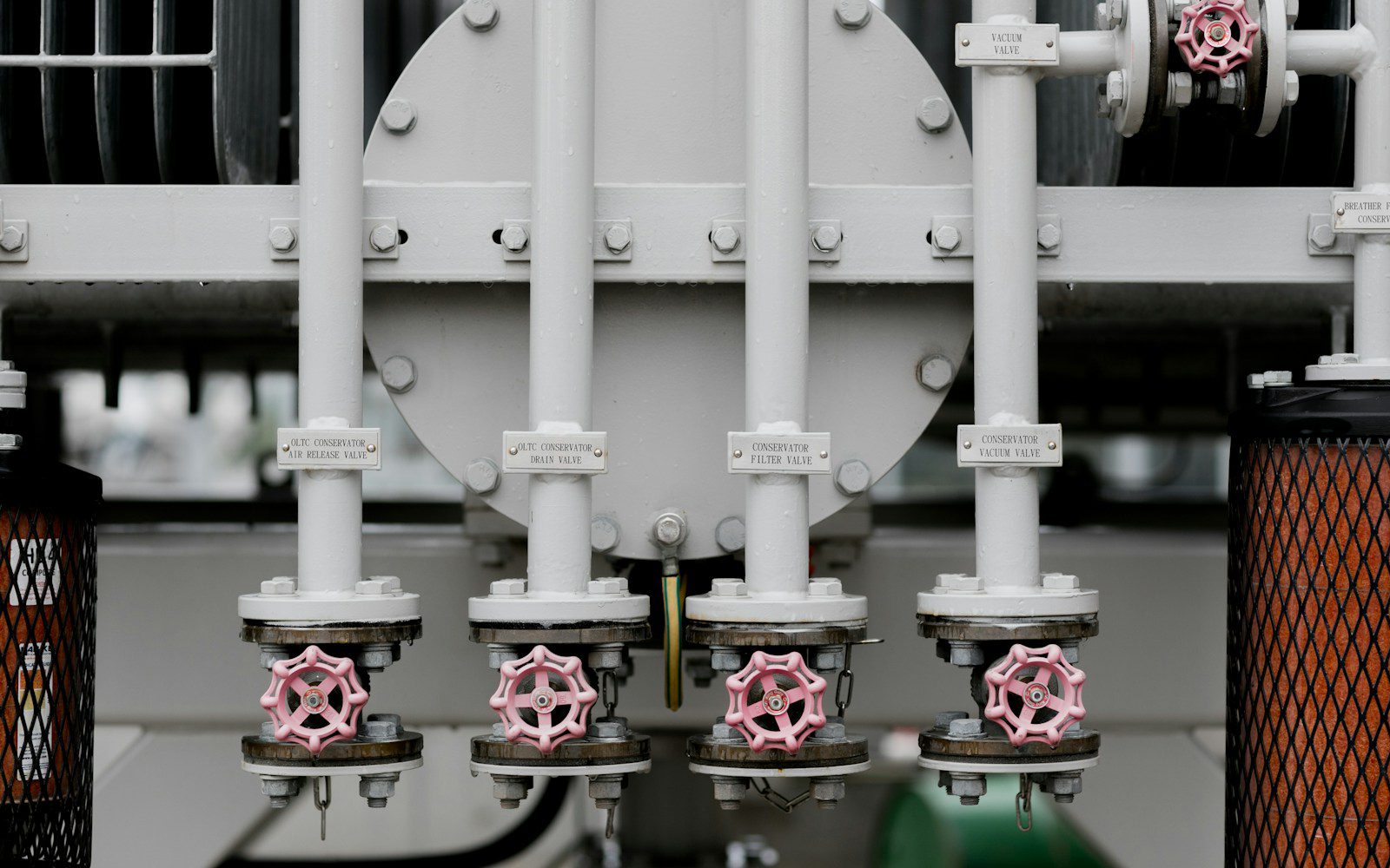 Pipes and valves are visible in this industrial image.