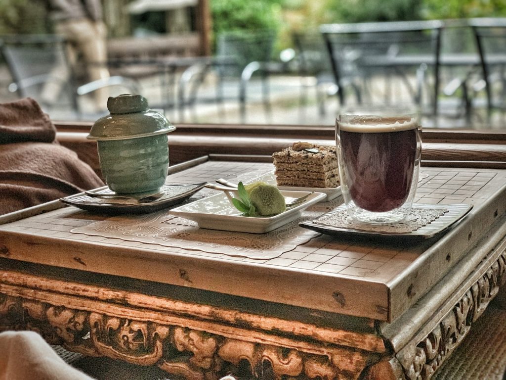 clear glass mug on brown wooden table