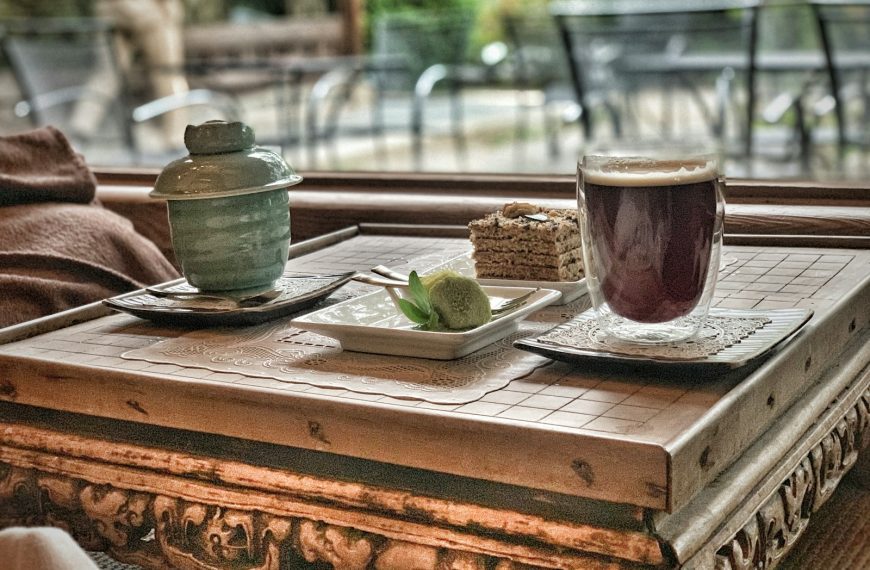 clear glass mug on brown wooden table