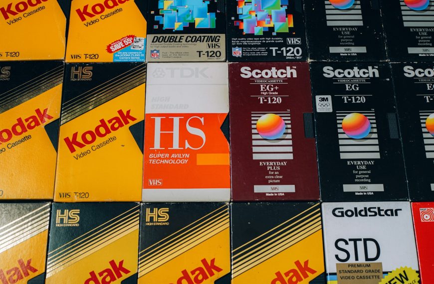 a pile of different colored and black and yellow business cards