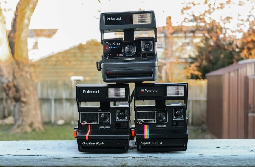 a couple of black rectangular objects with buttons and knobs on a table