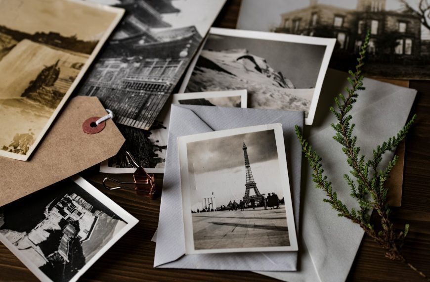 grayscale photo of Eiffel tower on top of white envelope