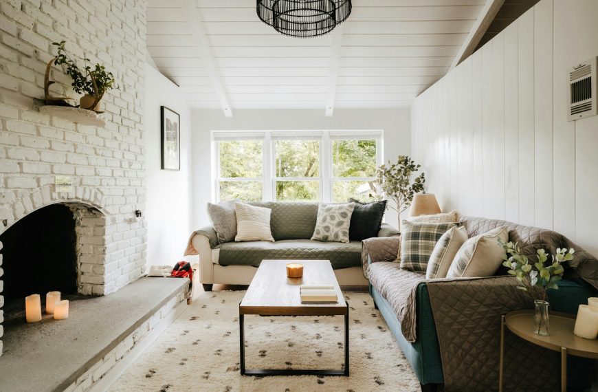 a living room filled with furniture and a fire place