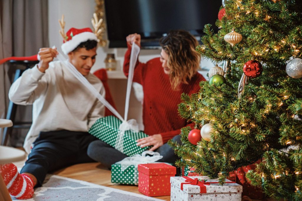 a man and a woman opening presents