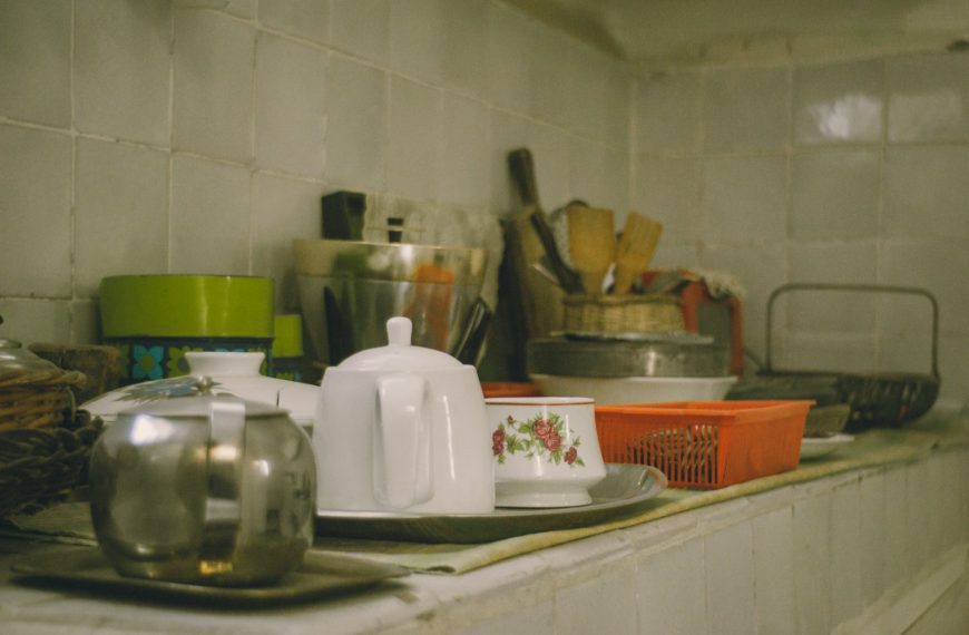 Various kitchenware items arranged on a shelf.