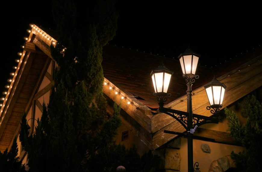 Streetlights illuminate a building at night