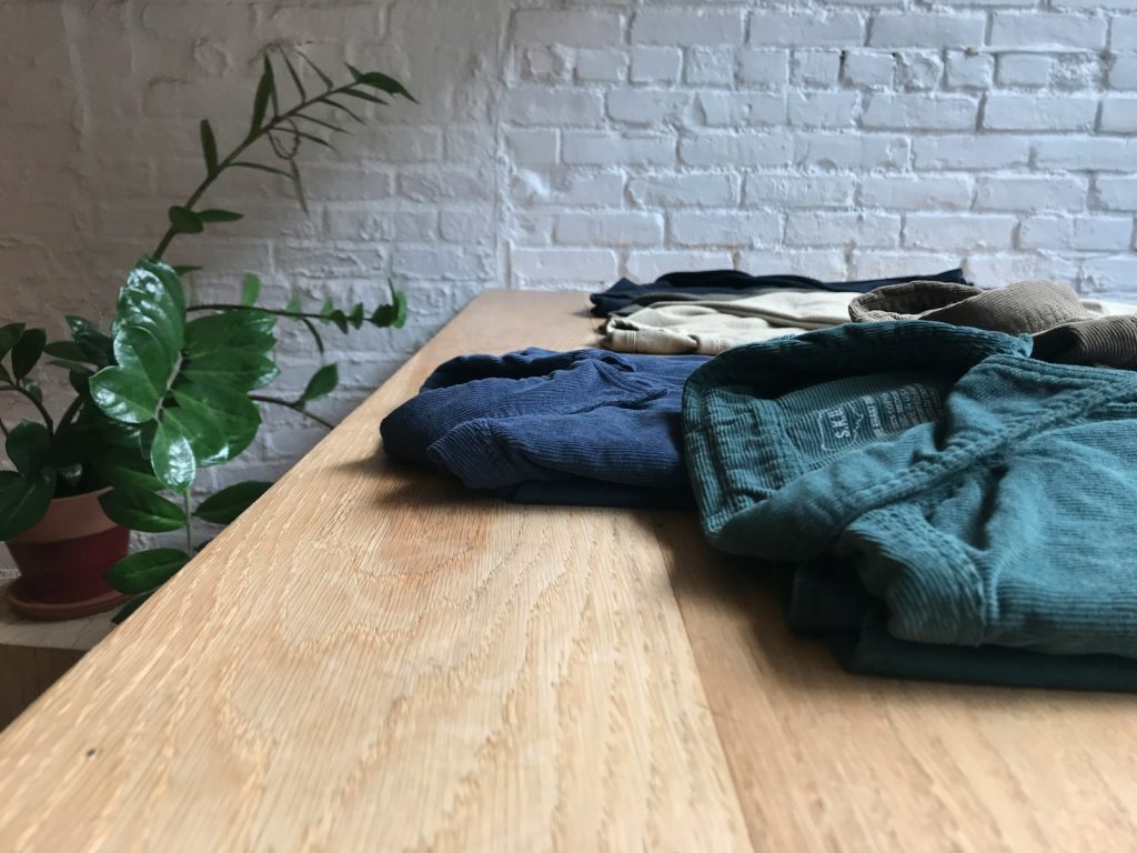 assorted-color apparels on table