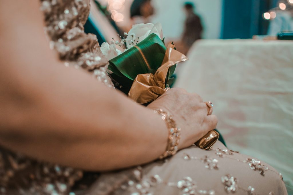 a close up of a person holding a present