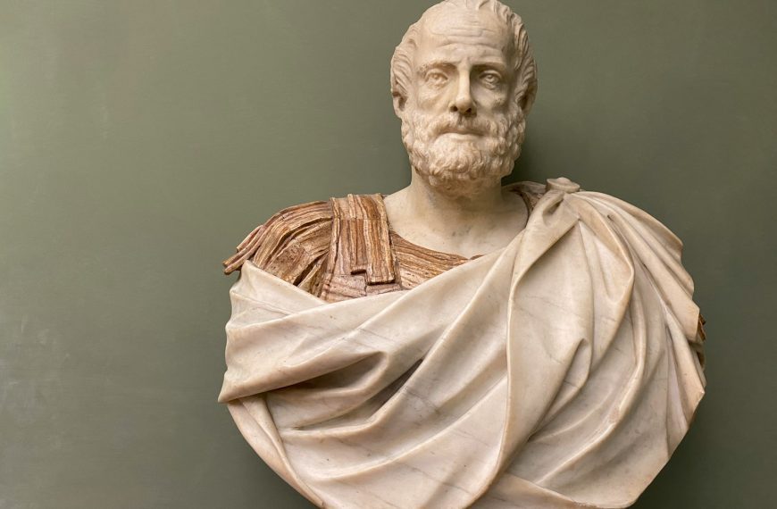 man in brown robe statue