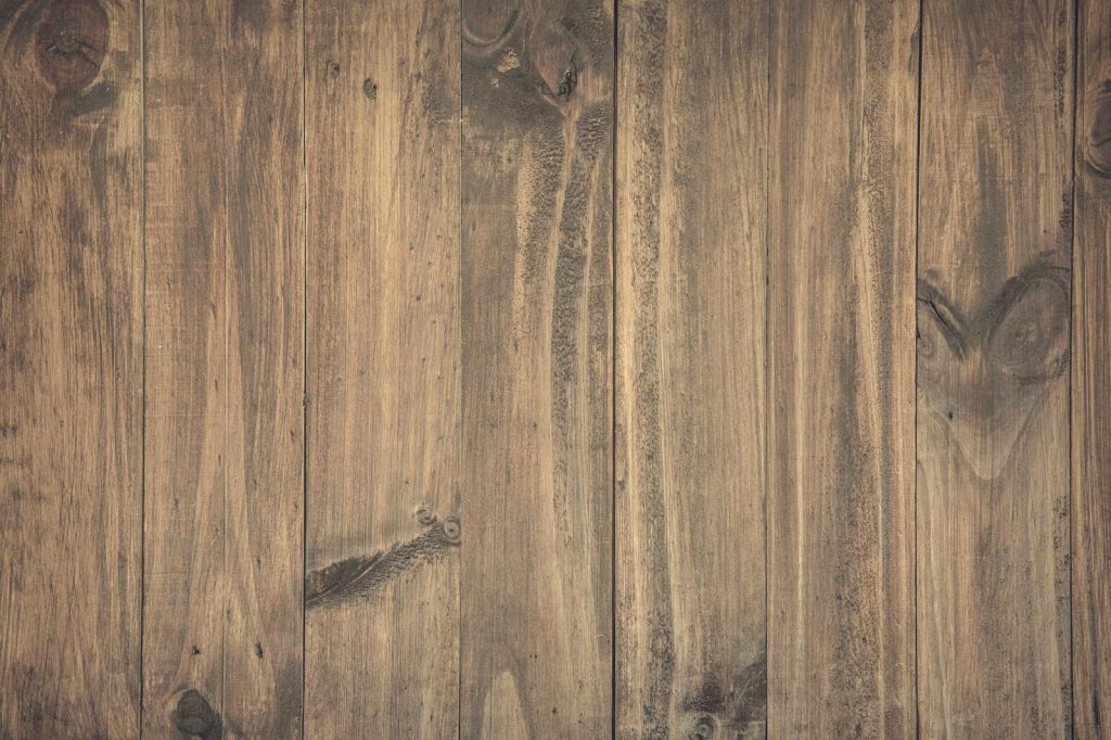 High-resolution image of rustic wooden planks with detailed grain texture, perfect for backgrounds.