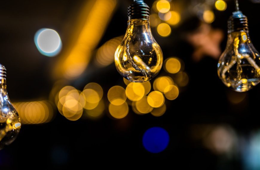 Artistic shot of hanging light bulbs with a beautiful bokeh background effect.