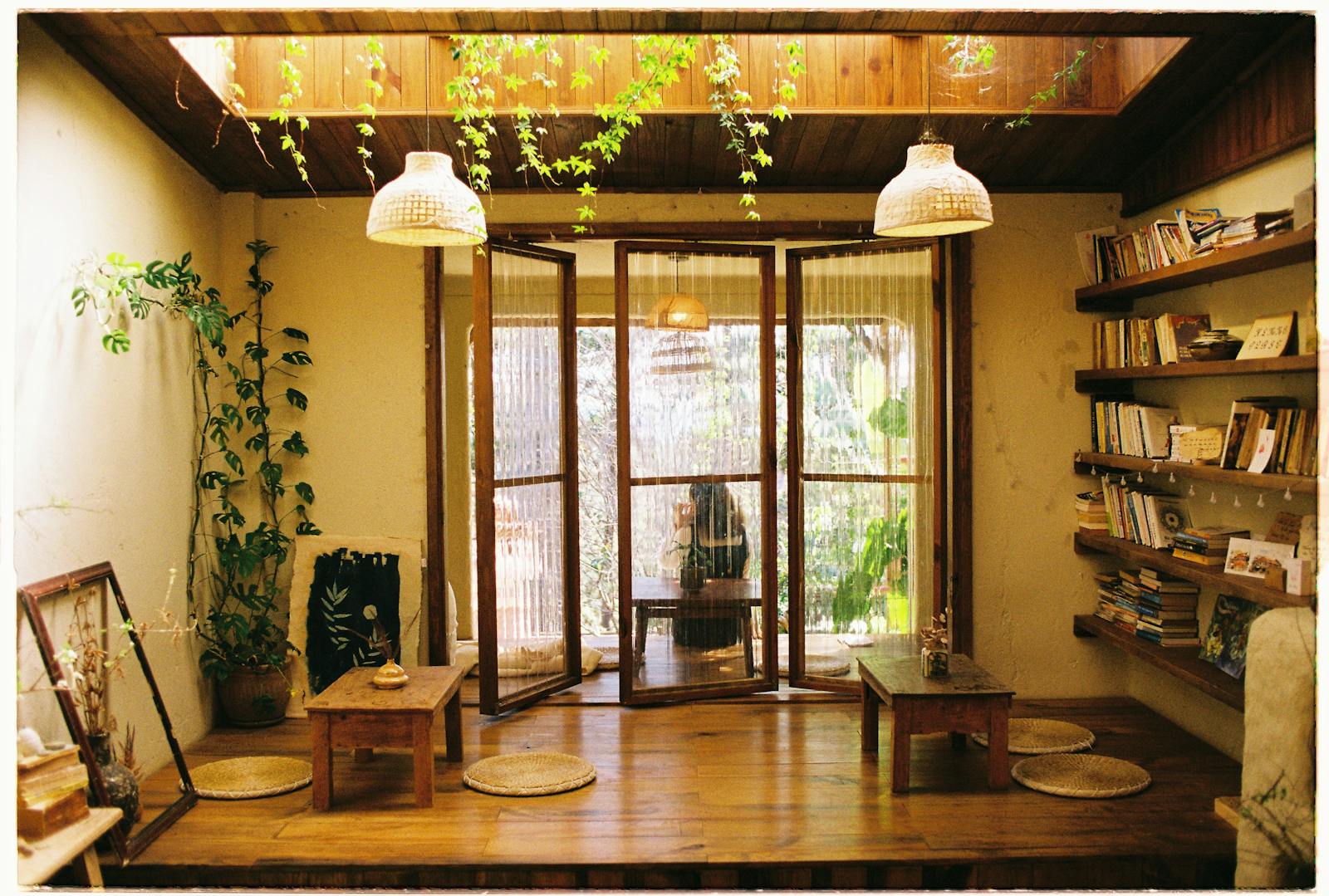 Warm room with wooden decor, bookshelves, and indoor plants.