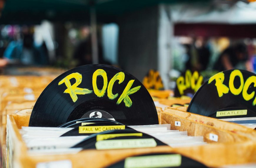 Colorful vinyl records labeled 'Rock' in a vintage music shop, perfect for music enthusiasts.