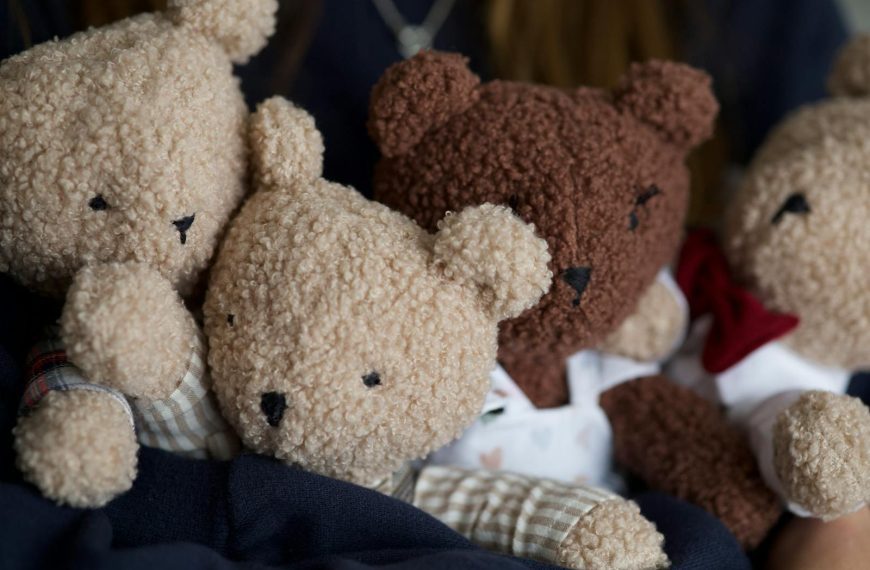 A heartwarming close-up of adorable plush teddy bears nestled together.