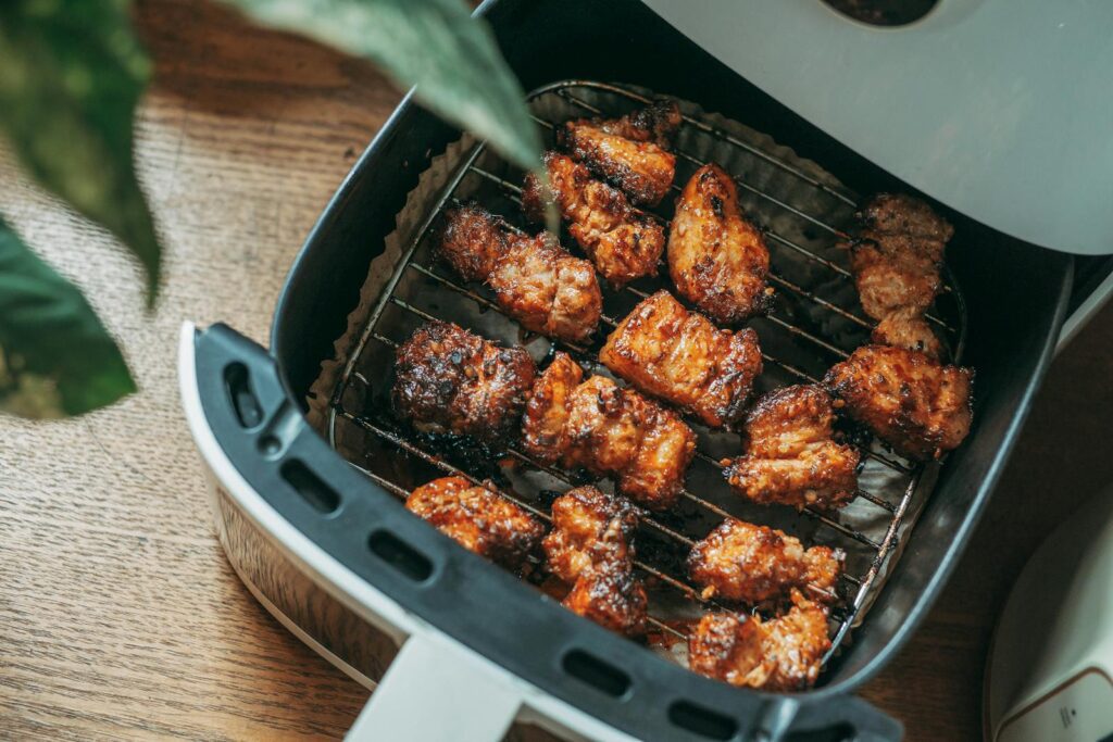 Delicious crispy chicken pieces cooked perfectly in a modern air fryer, ready to serve.