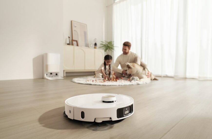 Robot vacuum cleans floor while family relaxes
