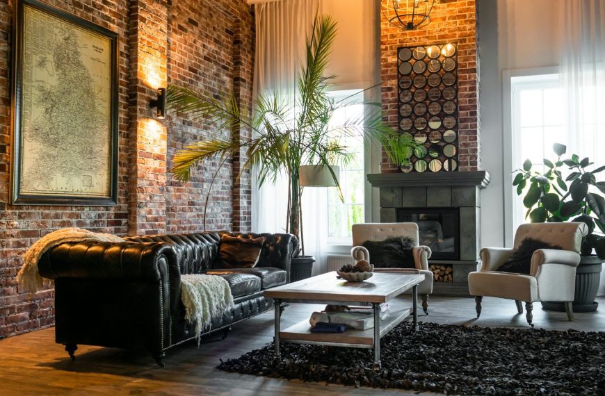Cozy living room with industrial design featuring brick walls, classic furniture, and chic decor.