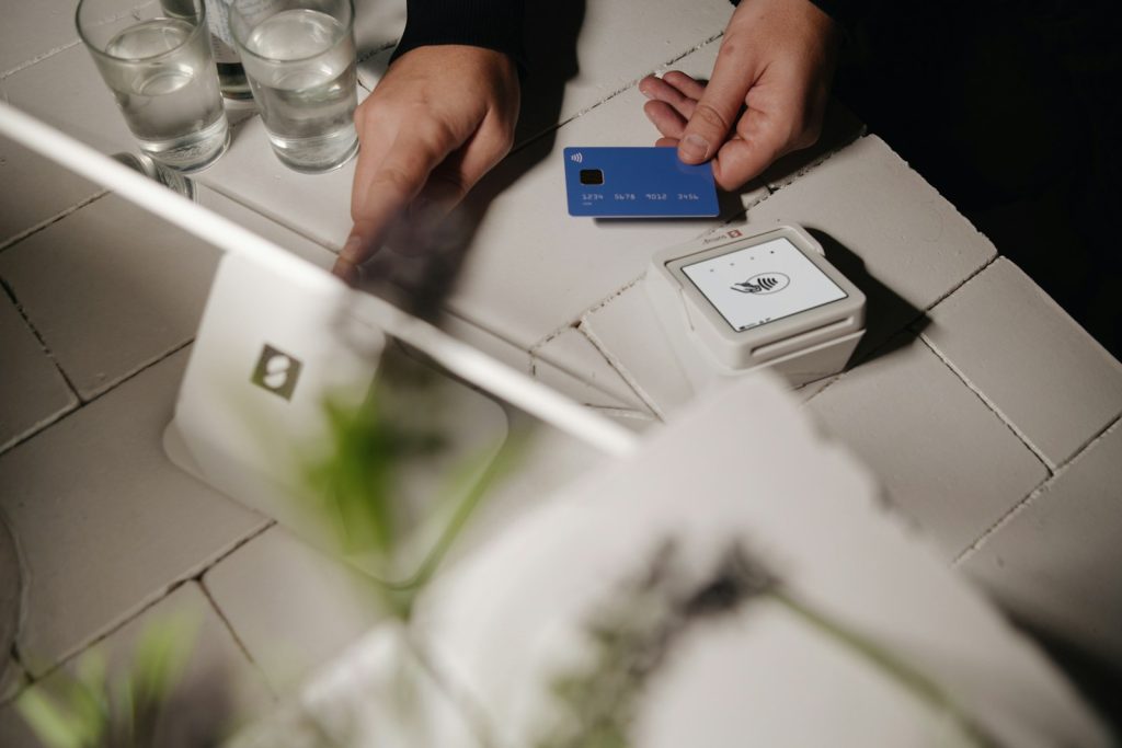 A person is about to pay with a credit card.