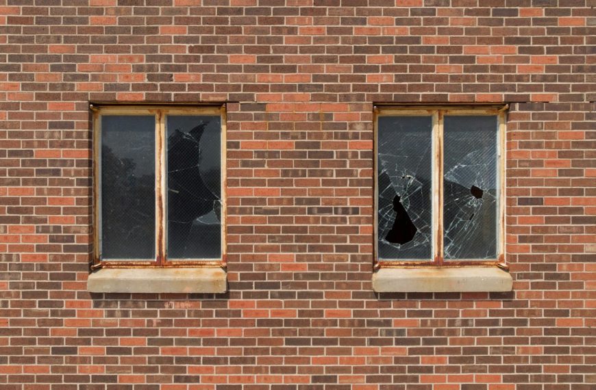 two broken glass building windows