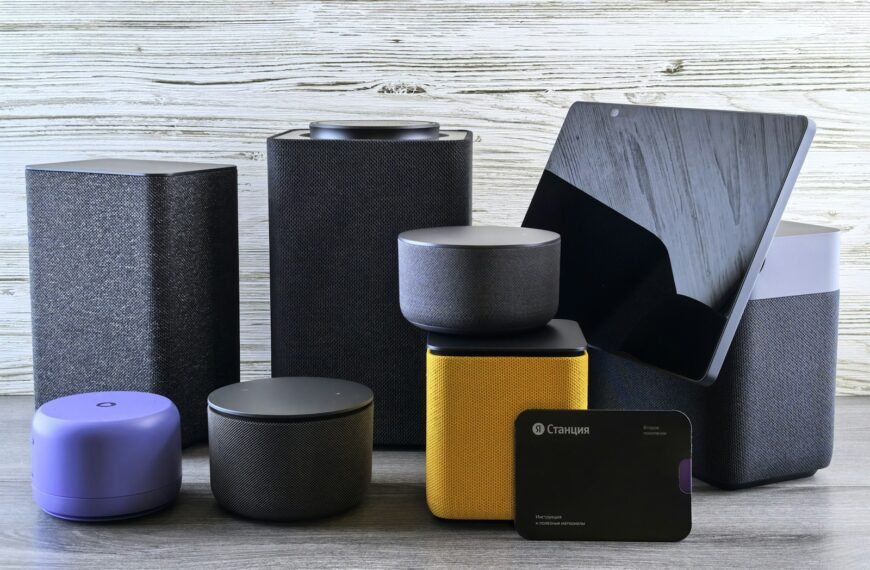 Collection of modern electronic devices and speakers.