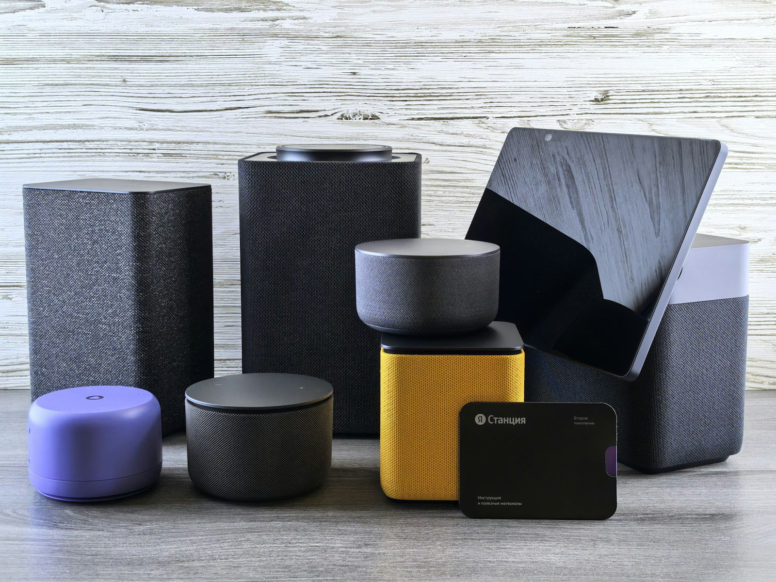 Collection of modern electronic devices and speakers.