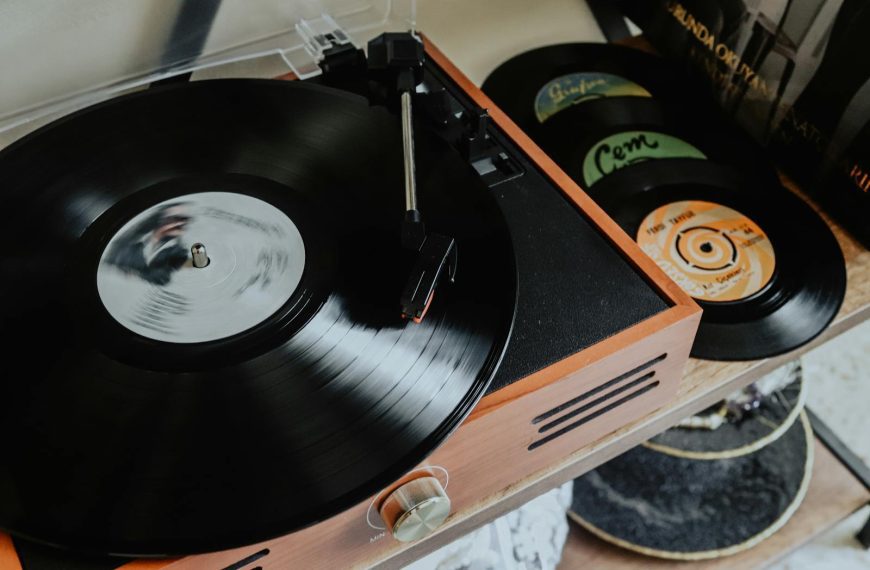 Close-up of a classic turntable playing vinyl records, evoking nostalgia and retro vibes.