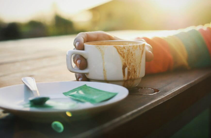 white ceramic mug on brown wooden table
