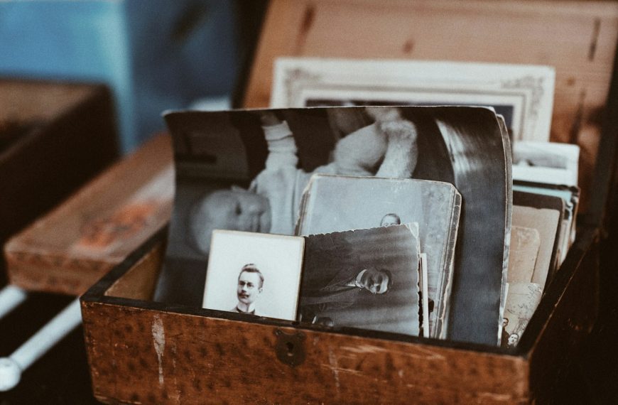 old photos in brown wooden chest