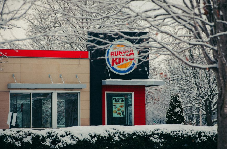 Burger king restaurant covered in snow.