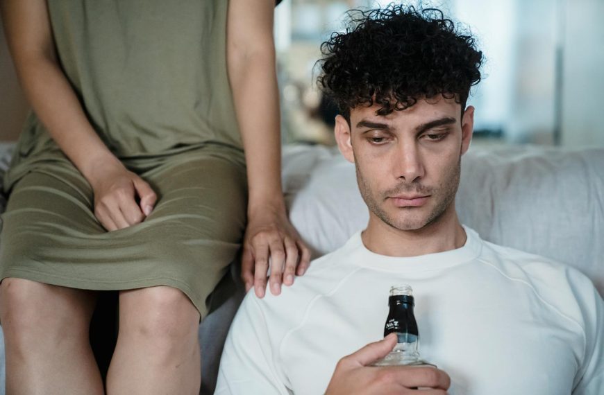 A man and a woman sitting together in a contemplative mood, highlighting introspection.