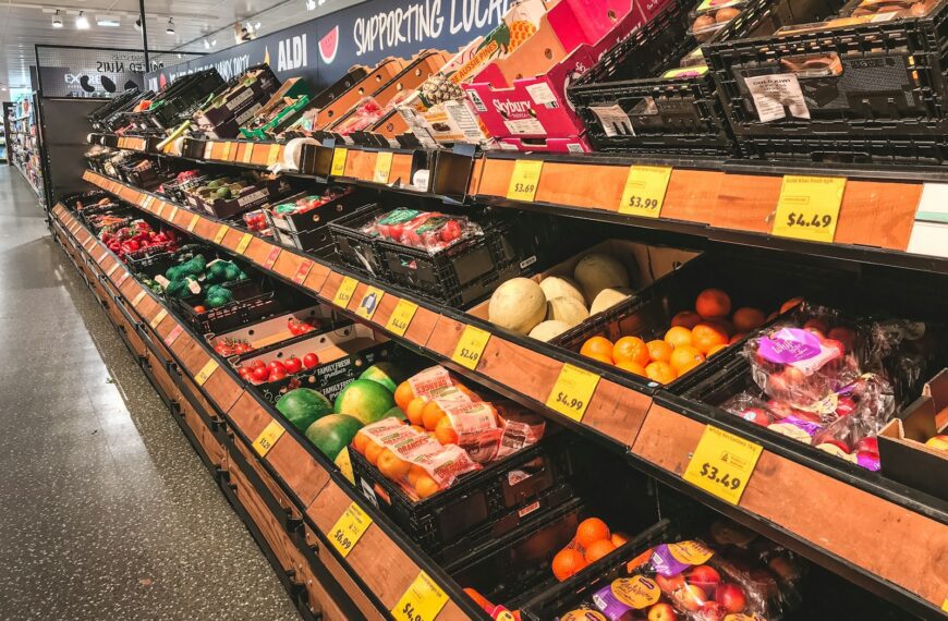 assorted fruits on brown wooden shelf