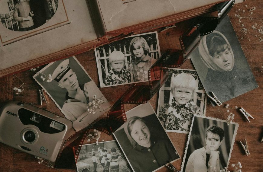 Nostalgic black and white prints with vintage camera and negatives evoke a bygone era.