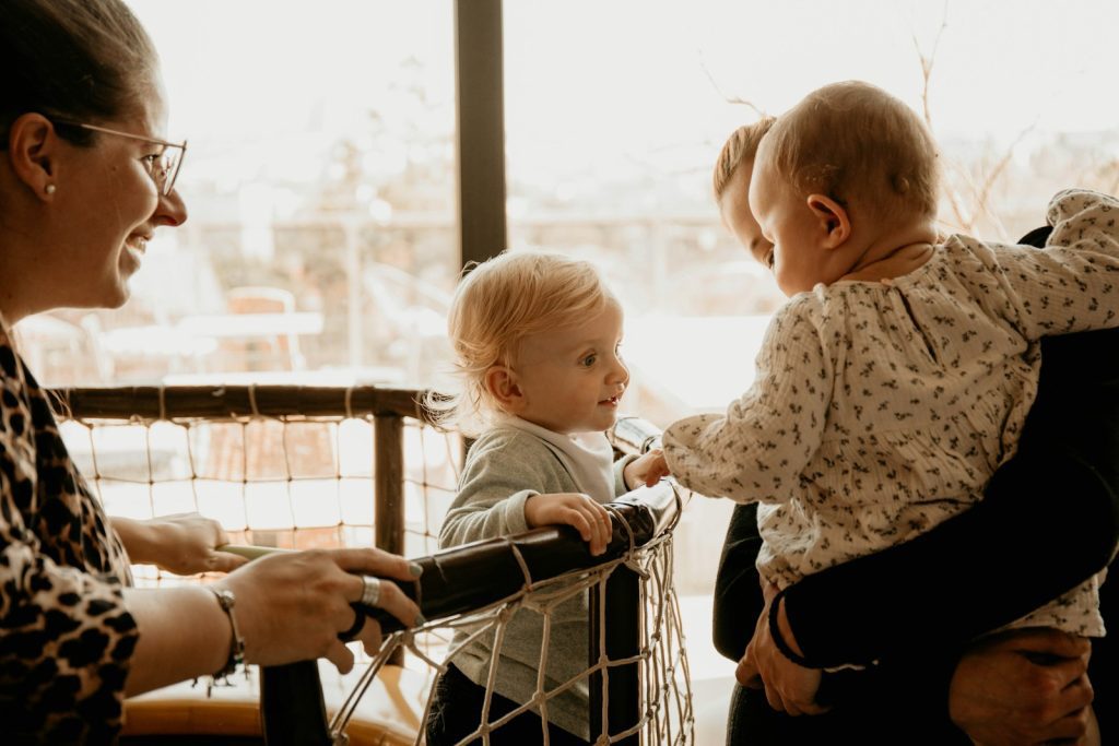 a woman and a child looking at a book