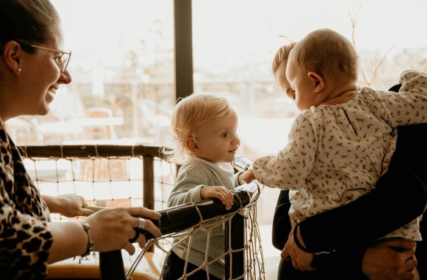 a woman and a child looking at a book