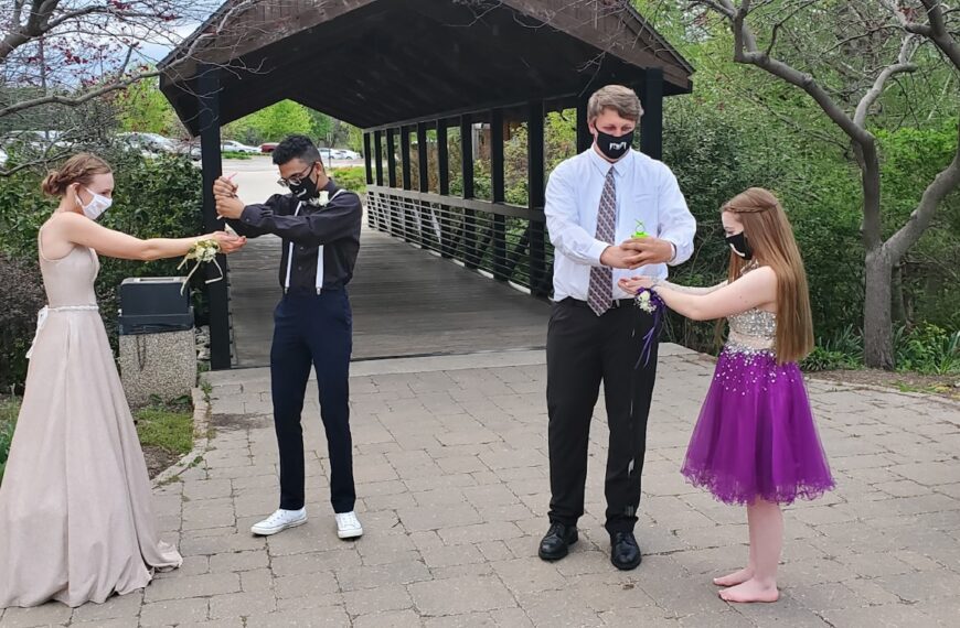 man in black suit jacket and woman in white dress shirt
