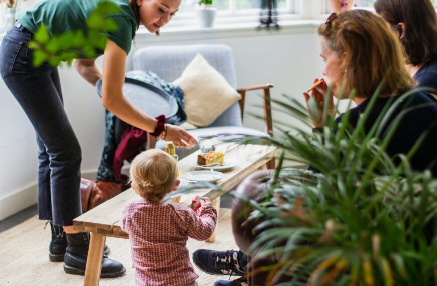 a woman and a little girl sitting at a table