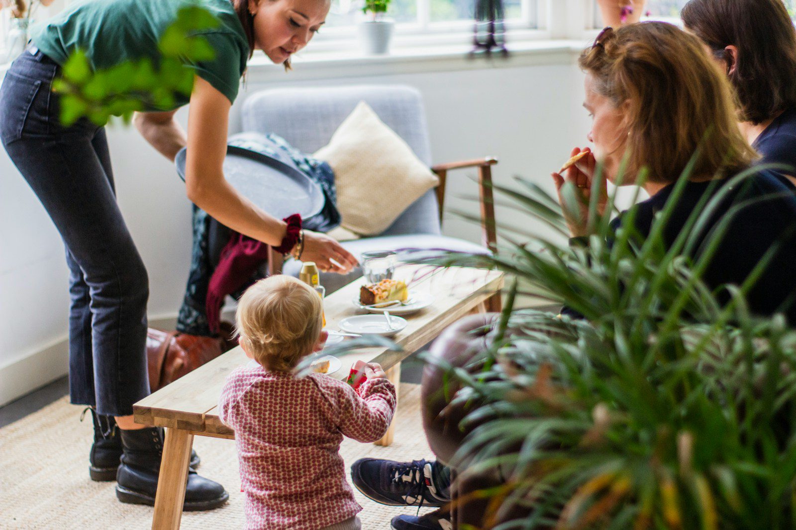 a woman and a little girl sitting at a table