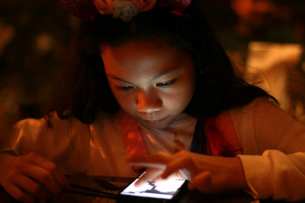 woman in orange long sleeve shirt