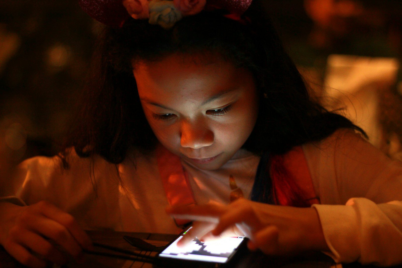 woman in orange long sleeve shirt