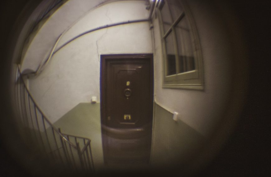 a door is seen through a circular lens