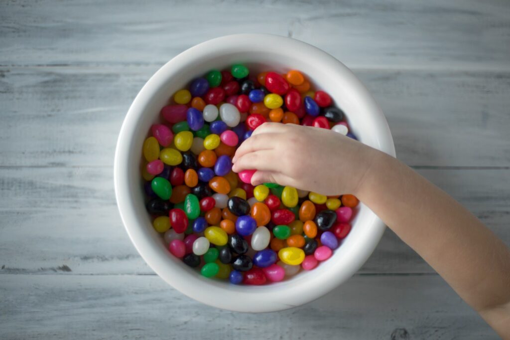 multicolored candies on white ceramic bowl