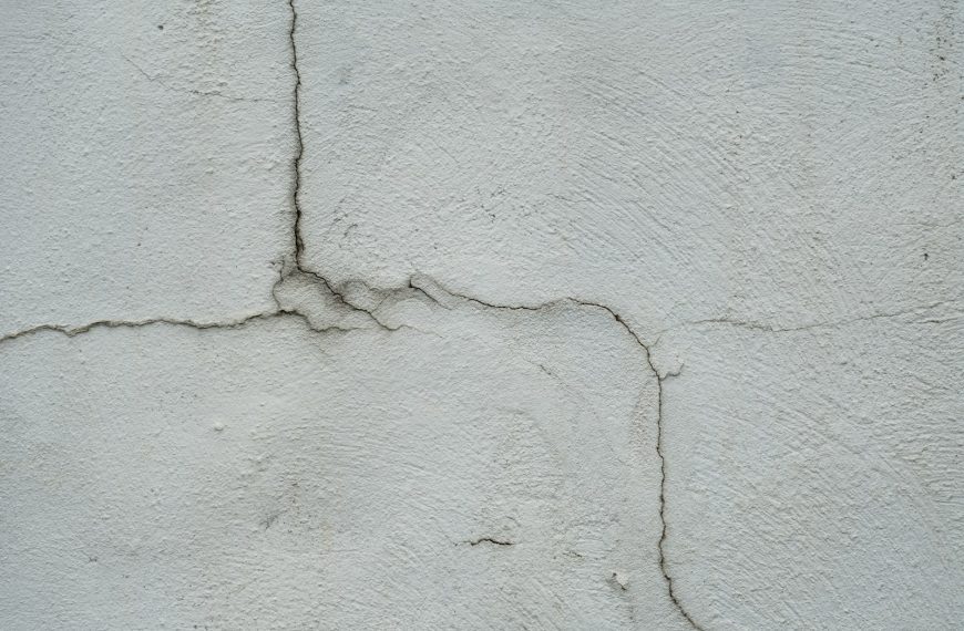 a crack in the side of a white wall